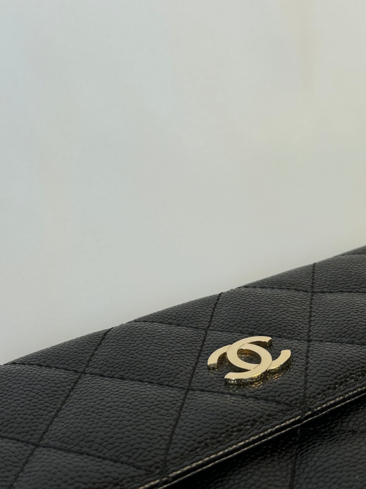 Chanel Quilted CC-flap clutch