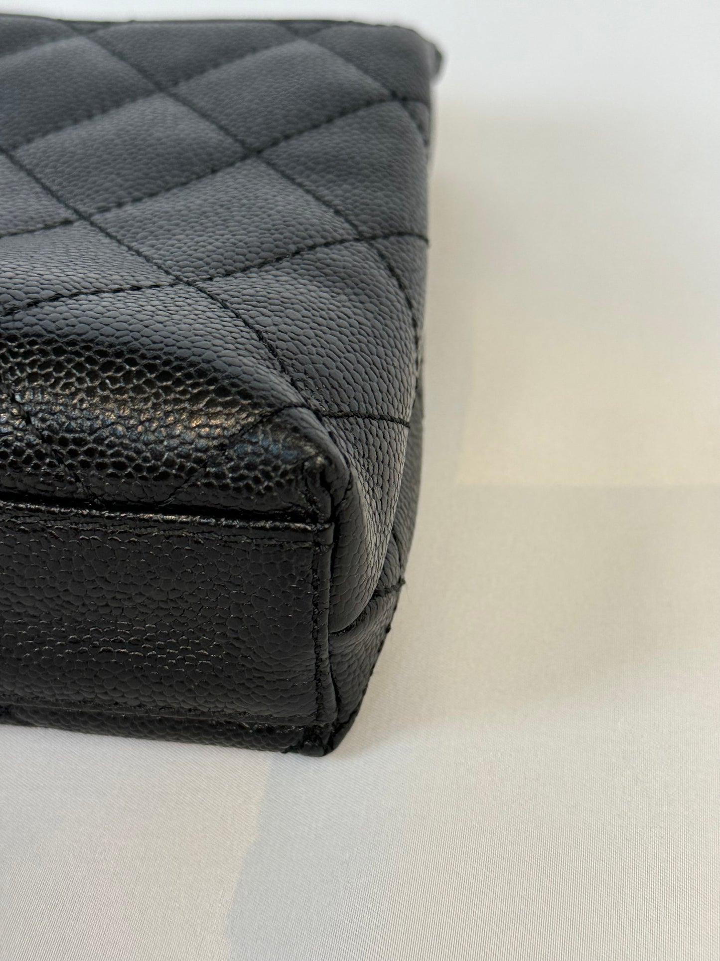 Chanel Quilted CC-flap clutch