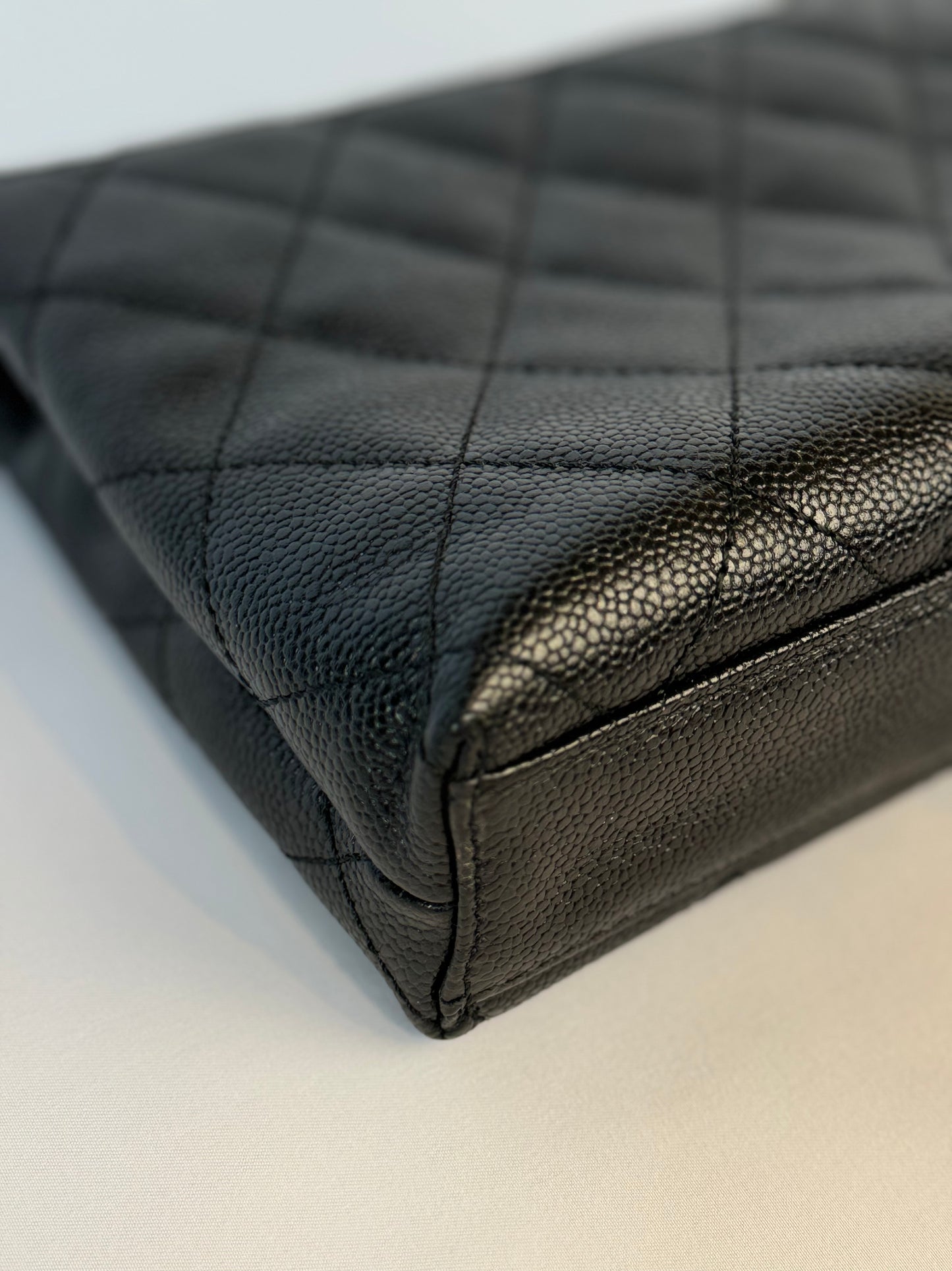 Chanel Quilted CC-flap clutch