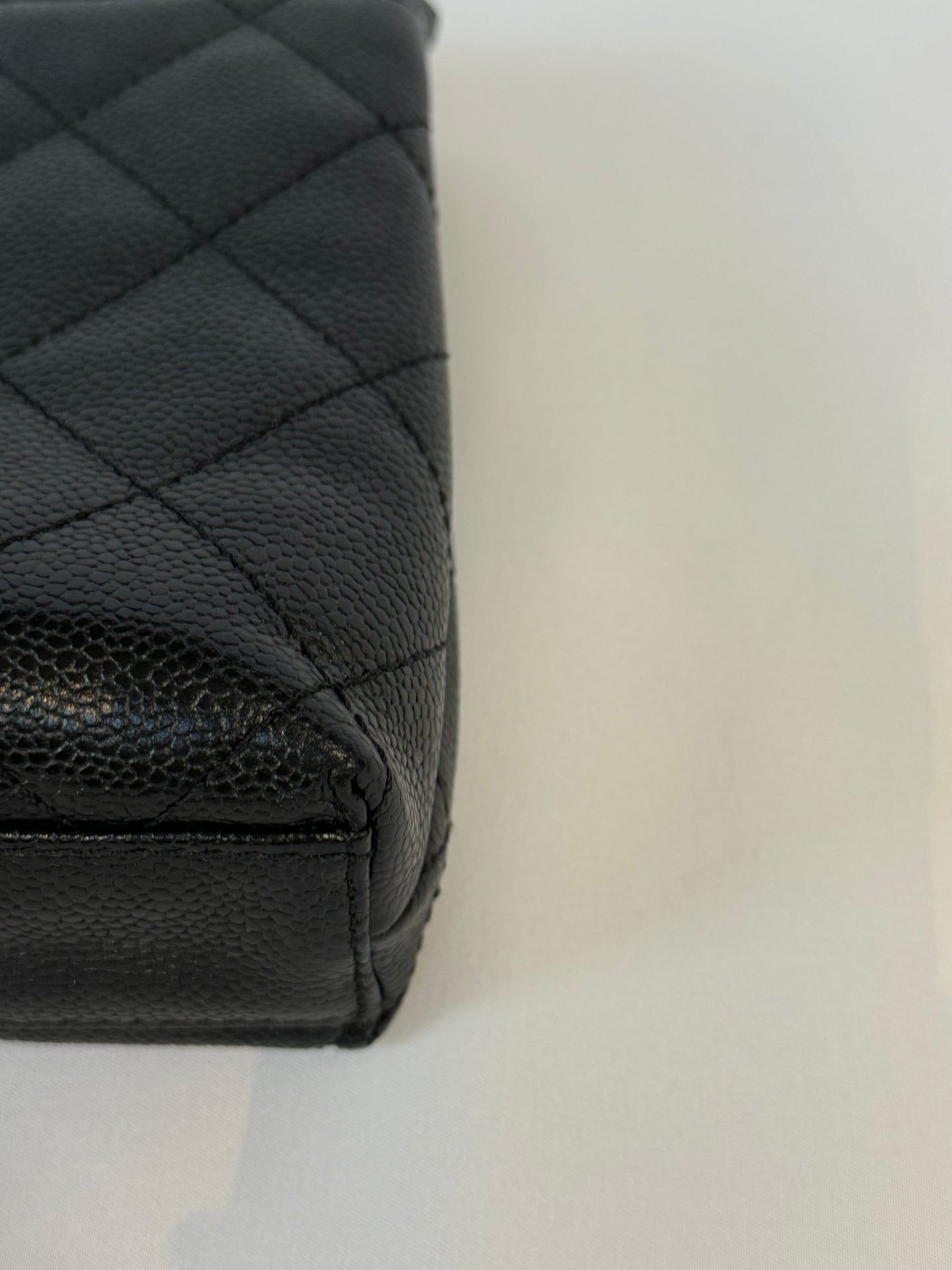 Chanel Quilted CC-flap clutch