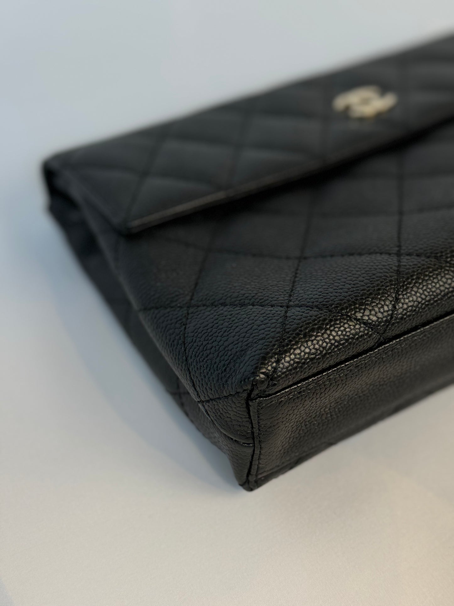 Chanel Quilted CC-flap clutch
