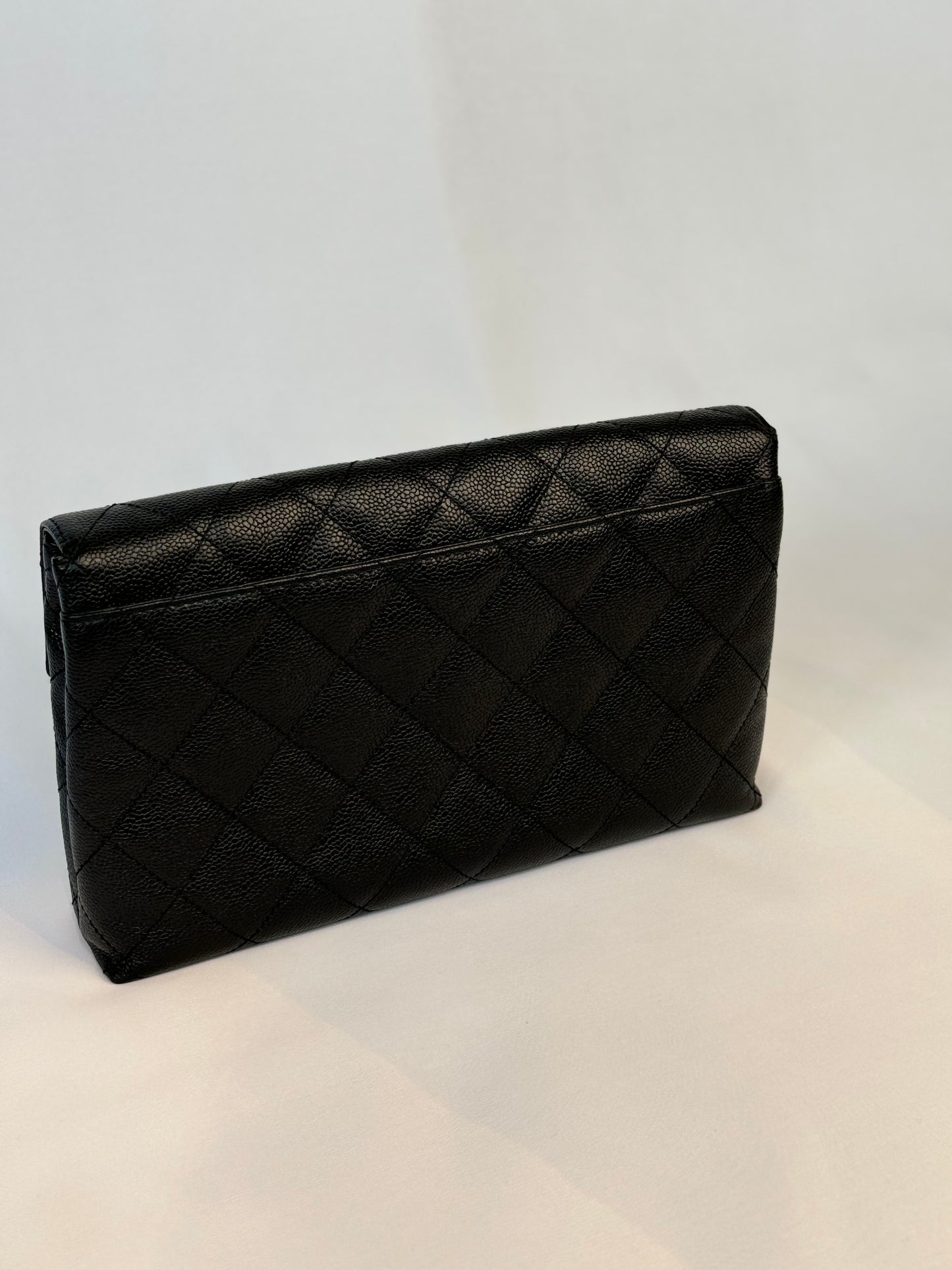 Chanel Quilted CC-flap clutch