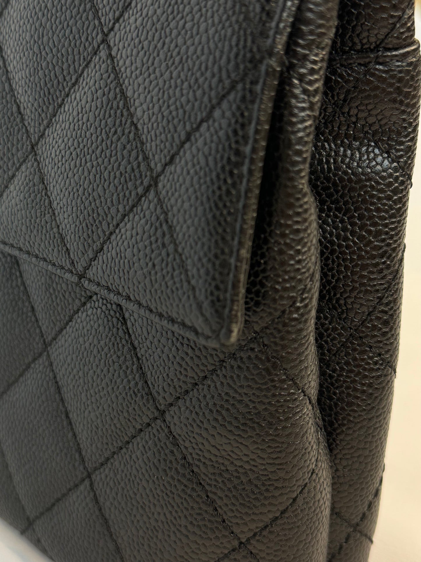 Chanel Quilted CC-flap clutch