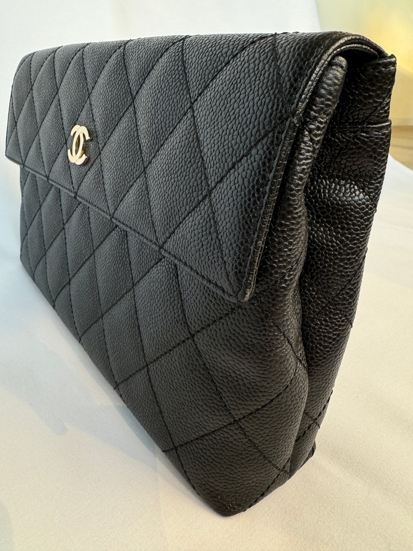 Chanel Quilted CC-flap clutch